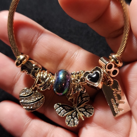 GOLD STAINLESS STEEL TWIST CHARM BRACELET - Picture 3 of 7